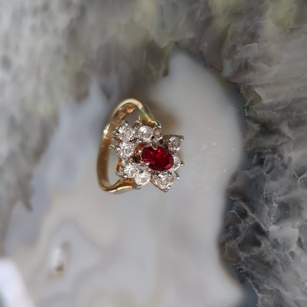 Ring with red center stone